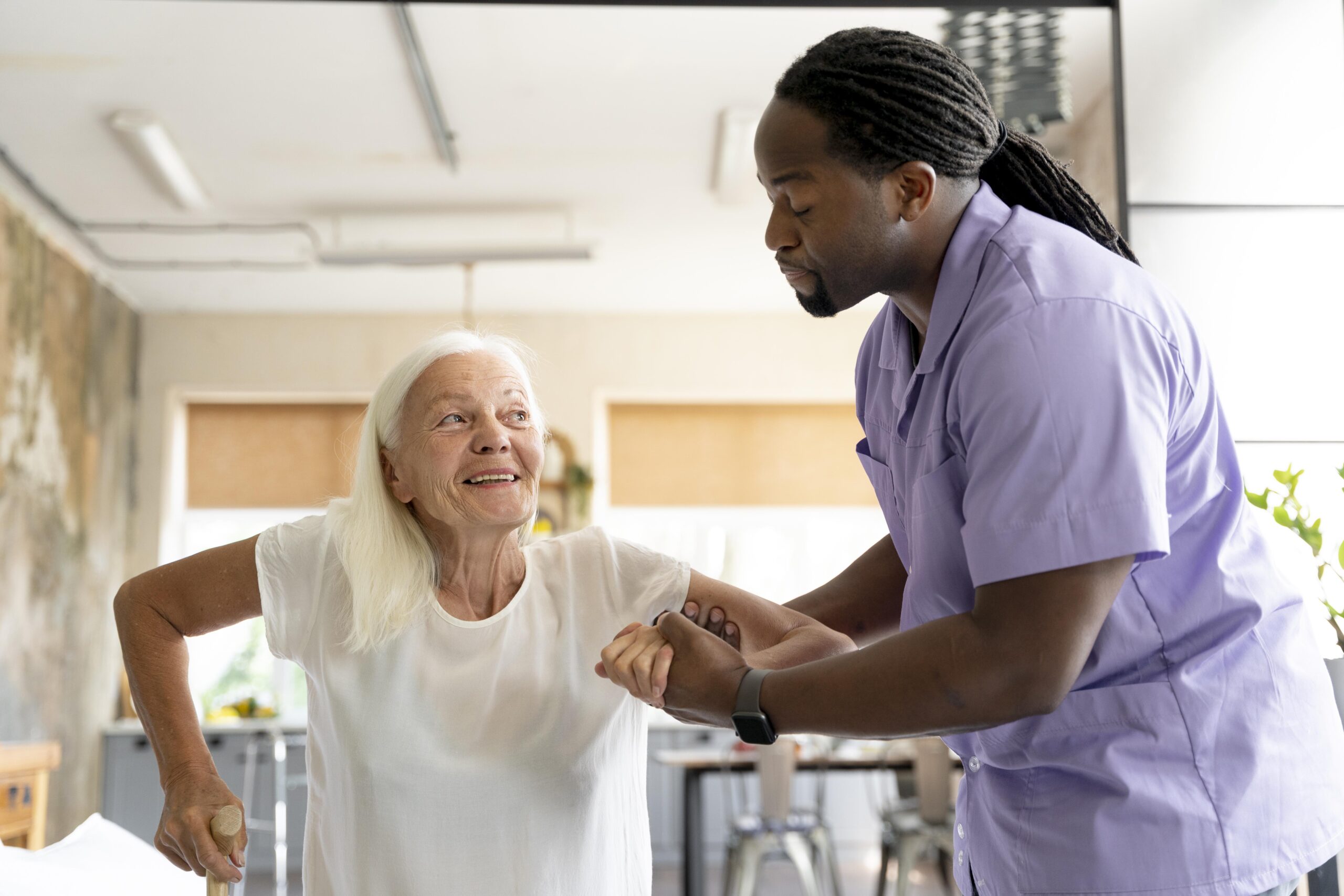 Nurse Talking To Senior Couple In Hospital Room
